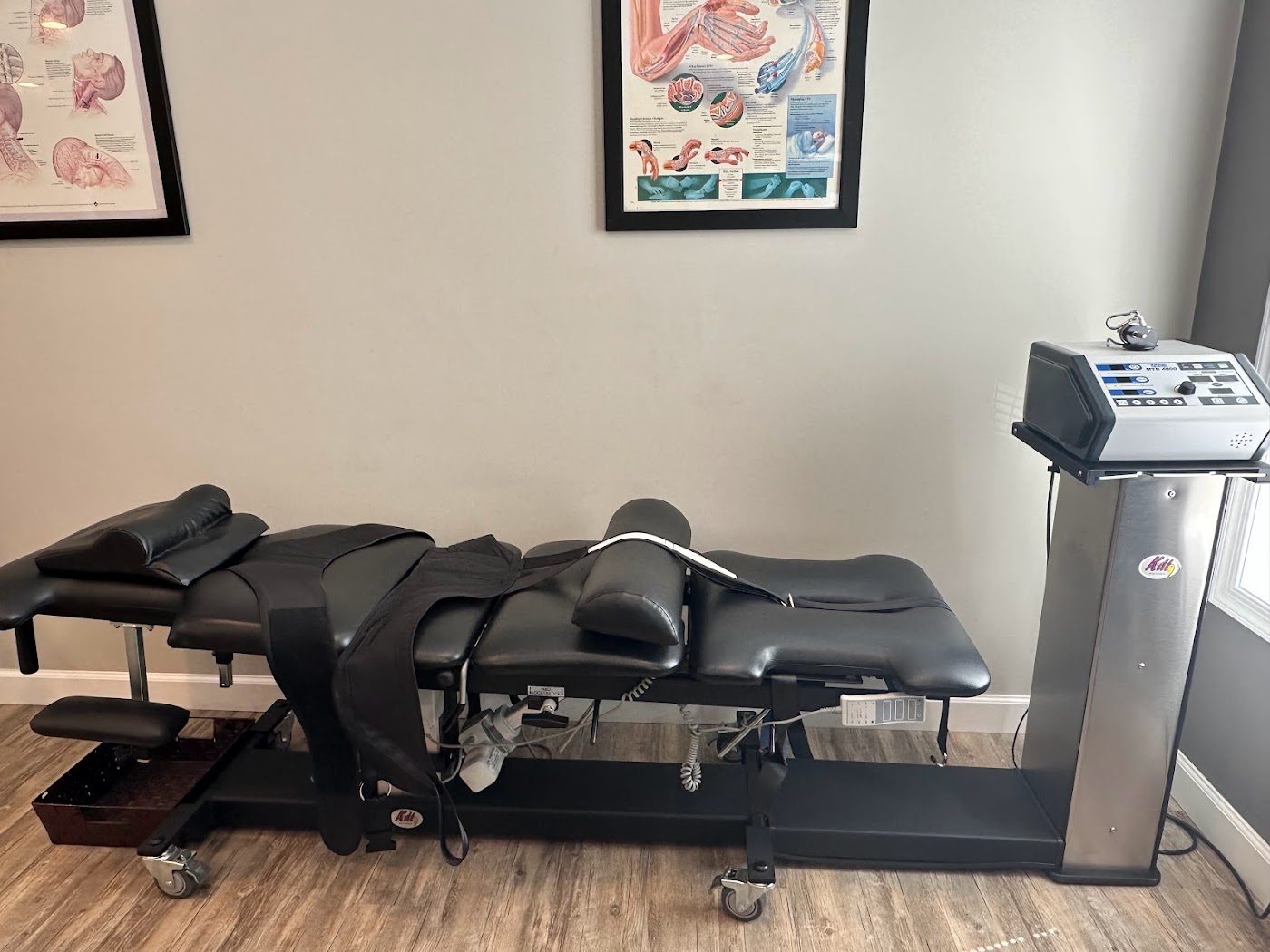 Spinal decompression table in a treatment room at the Manassas, VA office on Dorsey Circle
